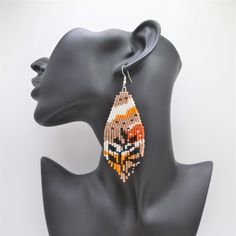 Beautiful Fringe Earrings created by Mannat Design Brown Dangle Beaded Earrings For Summer, Beige Dangle Jewelry With Colorful Beads, Beach Beaded Earrings With Colorful Beads, Beige Beaded Earrings For Beach, Bohemian Beige Beaded Earrings For Gifts, Handmade Brown Beaded Earrings, Handmade Brown Beaded Earrings For Summer, Handmade Brown Beaded Summer Earrings, Beige Beaded Earrings With Dangling Beads For Gift