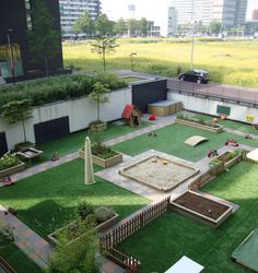 an outdoor play area with artificial grass