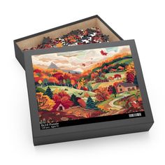 a puzzle box with an autumn scene on it