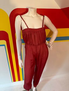 70s harem jumpsuit  Raspberry light as air poly with texture Harem pants with embroidered cuffs Nylon zip up the back Elastic waist Has belt loops but missing belt So 70s boho Gold accessories would make this pop! Great condition Xs - especially at the bust/back Top-most seam (goes over bust but under armpits) 26 - there is no stretch!  Bust up to 34 Waist 22-30 Hips 38 Rise to waist 10 Rise to shoulder 29 Inseam 27 Summer Strapless Sleeveless Jumpsuit With Elastic Waistband, Chic Fitted Jumpsuits And Rompers With Elastic Waistband, Chic Fitted Jumpsuit With Elastic Waistband, Fitted Casual Summer Jumpsuits And Rompers, Summer Maxi Length Jumpsuits And Rompers, Solid Maxi Jumpsuits And Rompers For Summer, Solid Color Maxi Length Jumpsuits And Rompers For Summer, Solid Maxi Length Jumpsuits And Rompers For Summer, Solid Color Maxi Length Jumpsuits For Summer