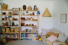 a living room filled with lots of books and toys