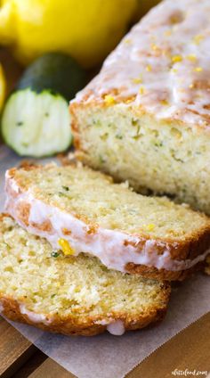 two slices of lemon zucchini bread sitting on top of a cutting board