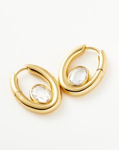 Oval Stone Small Hoop Earrings | 18k Gold Vermeil/Cubic Zirconia. Upgrade Your Party Season Ear Stack. These Limited-Edition Chunky Oval Hoops Feature Cubic Zirconia Stones, Faceted to Catch the Light. The Hidden Hinge is Designed for a Seamless Closure. Wear Solo or Team with Pavé Mini Hoops. Metal: 18K Recycled Gold Vermeil on Recycled Sterling Silver Dimensions: 20. 8mm X 15. 5mm Gemstone: White Cubic Zirconia Weight: 9g Product Code: Gu-G-E15-Cz Pave Ear Cuff, Medium Hoop Earrings, Small Hoop Earrings, Ear Stack, Star Earrings Stud, Long Chain Necklace, Cubic Zirconia Earrings, Stone Studs, Zirconia Earrings