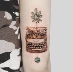 a woman's arm with an old typewriter tattoo on it