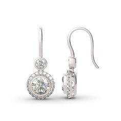 This beautiful style is a perfect gift for any lady or the perfect reason to spoil yourself! Designed in sterling silver, each earring features a sparkling round cut stone wrapped in a glistening halo as the drop. All stones glisten with every beat of her heart and every turn of her head. Celebrate your sweetheart with these sweet drop earrings.Carat Weight: 5 ctStone Size: 7 mmStone Type: Jeulia® StoneNumber of Stones: 2 Carat Weight: 1.29 ctStone Size: 1.3,4 mmStone Type: Jeulia® StoneNumber o White Diamond Earrings, Fashion Edgy, Halo Earrings, Sterling Silver Drop Earrings, Stone Wrapping, Earrings Drop, Everyday Earrings, Silver Drop Earrings, Online Earrings