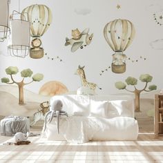 a child's bedroom decorated in white and green with hot air balloons