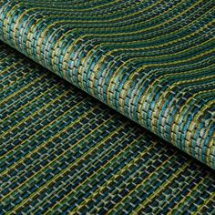 a close up shot of a green and blue fabric