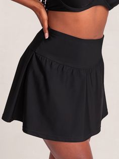 Your sunny adventure sidekick, Shapermint Essentials High Waisted Full Coverage Swim Skirt gives you the full-coverage confidence and flattering fit you deserve. Take this versatile flounce skirt style from brunch to the beach. Its wide and high-profile waistband smooths your midsection, and its built-in bikini bottom delivers maximum comfort. Pair this skirt with the Shapermint Essentials Full Coverage Halter Bikini Top and your outfit is complete! Wide Waist Band for Smoothing No Muffin Top Fl Flowy Tiered Skirt With Built-in Shorts, Flowy Skirted Swim Skirt With Built-in Shorts, Solid Color Stretch Tiered Tennis Skirt, Stretch Solid Pleated Swim Skirt, Solid Mini Swim Skirt With Lining, Stretch Solid Color Pleated Swim Skirt, Stretch Pleated Solid Color Swim Skirt, Lined Mini Swim Skirt, Solid Color Pleated Tiered Skort