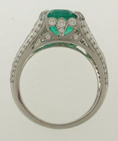 A Green 3.19ct Emerald From Colombia, Set in a Fancy Platinum Ring with Diamonds that weigh a total of 0.85ctw, H/VS Respectively. Ring Weight is 7.8 Grams. Currently a Finger Size of 6.5 and Will Be Sized to Fit!!! Dazzling Oval Emerald Ring In Platinum, Exquisite Platinum Emerald Ring, Green Platinum Ring With Pavé Setting, Green Platinum Rings With Pave Setting, Elegant Round Emerald Ring Gia Certified, Elegant Round Emerald Ring, Gia Certified, Elegant Gia Certified Round Emerald Ring, Exquisite Brilliant Cut Emerald Ring In White Gold, Exquisite Brilliant Cut White Gold Emerald Ring