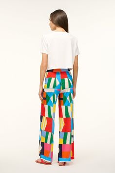 Stand out at the pool with the Copano Pant by Staud. The geometric mesh print is an eye-catcher. Pair with a white or black swimsuit, and even a white tee if you need to escape the sun. Summer Wide Leg Bottoms With Abstract Print, Wide Leg Bottoms With Abstract Print For Summer, Summer Wide-leg Bottoms With Bold Print, Summer Bold Print Wide Leg Bottoms, Summer Wide Leg Bottoms With Bold Print, Casual Summer Pants With Bold Print, White Summer Pants For Poolside, Summer White Pants For Poolside, Chic Summer Bottoms With Geometric Pattern