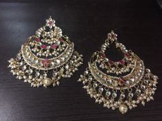 Indian Kundan Jewelry Designer Chandbali Earrings Ethnic wear Gold Tone Chand Bali for Indian Women and perfect match for all Bridal Outfits. *It's Handmade Indian Ethnic Kundan Chandbali Earrings with Pearl drop. *It's made from Silver n Copper with White Kundan Stones Settings with 22k gold Plating as shown in picture. *It gives Pure Ethnic Look with Antique Touch and it is 3.8 inch long and 2.8 inch wide. It is heavy fashion statement chand bali specially design for unique look. *Our all jewe Traditional White Hand Set Chandbalis, Handmade Chandbali Bridal Earrings, Handmade Festive Chandbali Bridal Earrings, Handmade Temple Jewelry Chandbalis For Celebration, Handmade White Chandbalis For Festive Occasion, Traditional Pink Chandbalis With Cutdana, Bollywood Style Bridal Chandbali Earrings Handmade, White Bollywood Style Hand Set Earrings, Handmade Chandbalis For Wedding And Diwali