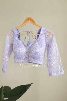 Beautiful hand embroidery work blouses in light pink and lilac. Very good finishing. It is worn or styled in any matching saree, lehenga etc.  Size Guide: UK       8       10    12    14 usa      4       8      10    12 Euro    34     36    38   40 Please Dm for any for more informations. Wedding Blouse With Chikankari Embroidery For Eid, Fitted Tops With Mirror Work For Eid, Purple Blouse With Mirror Work For Reception, Purple Chikankari Traditional Wear For Reception, Reception Purple Traditional Wear With Chikankari Embroidery, Embroidered Pre-draped Saree For Party, Embroidered Long Sleeve Pre-draped Saree For Party, Long Sleeve Embroidered Pre-draped Saree For Party, Fitted Long Sleeve Embroidered Pre-draped Saree