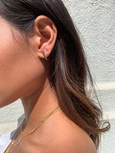 DESCRIPTIONA not so basic, basic. These tiny studs are perfect to keep in your second or third holes, forever and ever. 14k earring backs included. DETAILS- always made in 14k gold - stud measurement: 2mm