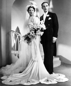 an old black and white photo of a bride and groom