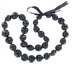 PRICES MAY VARY. Genuine kukui nuts Symbol of peace, enlightenment, protection Approximately 32 inches long 8 oz Exotic genuine black kukui nut lei necklace with grosgrain ribbon, made with 32 genuine Hawaiian kukui nuts, each approximately 3cm diameter. The Kukui Tree is commonly grown on the Hawaiian Islands. It is a symbol of enlightenment, protection, and peace. Necklace length: approximately 32". Hickory Nut Jewelry, Kukui Nut Lei, Seed Craft, Hawaiian Necklace, Peace Necklace, How To Make Decorations, Hawaiian Lei, Skin Lightening Cream, Kukui Nut