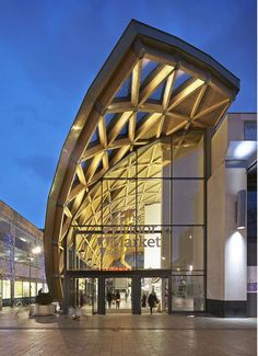 the entrance to a large building at night