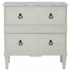 a white dresser with two drawers and marble top on the bottom, against a white background