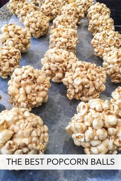 popcorn balls on a baking sheet with the words gooey popcorn balls in front of them