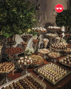 a table topped with lots of different types of desserts