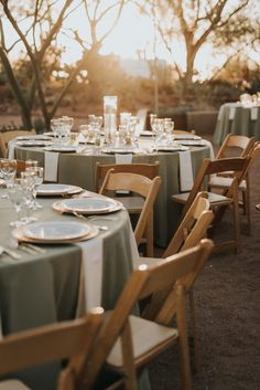 the tables are set with place settings for guests to sit down and enjoy their meal