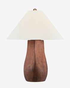 a wooden table lamp with a white shade