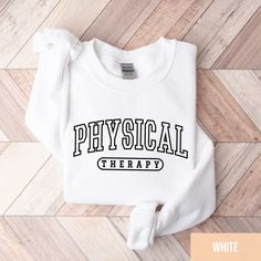 Physical Therapist Sweatshirt, PT Sweatshirt, Physical Therapist Gift, Physical Therapy Assistant PTA Grad Gift, Doctor Of Physical Therapy *PRODUCTION TIME* 1-6 days (Usually 2 days) *SHIPPING TIME* 2-5 days *PRODUCT DESCRIPTION* *Bella Canvas Unisex T-shirt Super soft cotton and excellent quality print makes. 100% Soft cotton (fibre content may vary for different  colors) Light fabric (4.2 oz/yd² (142 g/m Runs true to size Retail fit Our Relaxed Fit Tee (Bella + Canvas style 3001) is a  unisex style  that runs a touch small for men, and  about a half a size large for women. It's a relaxed fit  and is soft and cozy. *Unisex Sweatshirt 50% cotton, 50% polyester Loose fit Runs true to size Sewn-in label *CARE INSTRUCTION* Machine wash: warm (max 40C or 105F); Non-chlorine:  bleach as needed White Relaxed Fit Sweater For College, White Crew Neck Sweats For College, White Relaxed Fit Sweatshirt For College, White Cotton Sweats With Letter Print, White Letter Print Sweater For Sports, White Sports Sweater With Letter Print, White Graphic Print Sweats With Relaxed Fit, White Graphic Print Sweats Relaxed Fit, White Relaxed Fit Sweats With Graphic Print