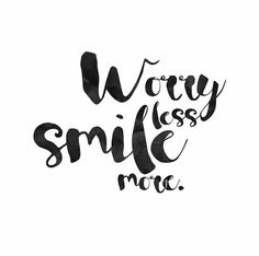 the words worry less smile more in black ink