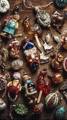 an assortment of christmas ornaments on a table