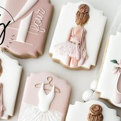 decorated cookies are arranged in the shape of ballerina's dresses and ballet shoes