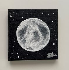 a black and white painting of the moon