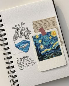 an open notebook with some drawings on it