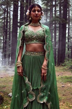 Fern green layered lehenga with embroidery on the waist. Comes with embroidered blouse and dupatta.
Component: 3
Pattern: Embroidery
Type Of Work: Mirror, Sequin and Cutdana
Neckline: Leaf
Sleeve Type: Half
Fabric: Crepe and Tissue
Color: Green
Other Details: 
Padded blouse
Dupatta with embroidered scallop border
Closure: Back zip
Occasion: Sangeet - Aza Fashions Paulmi And Harsh, Layered Lehenga, Leaf Sleeve, Embroidery Mirror, Scallop Border, Green Mirror, Padded Blouse, Glam Chic, Trendy Sarees