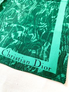 Malachite marble faux bois silk pocket square scarf. Great on a bag to add a pop of color. We also love wearing these at the neck or on the wrist mingled with your bracelet stacks. Christian Dior Poison perfume advertising scarf. 13" x 12.5" Trendy Green Silk Scarf Gift, Chic Green Silk Scarf Gift, Chic Green Silk Scarf For Gift, Luxury Square Silk Scarf For Gift, Dior Poison Perfume, Perfume Advertising, Christian Dior Poison, Poison Perfume, Bracelet Stacks