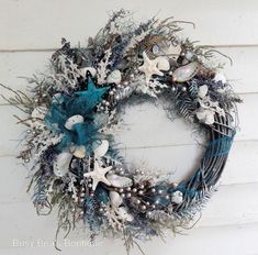 a wreath with seashells and starfish on it