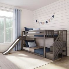 a bedroom with bunk beds and a slide