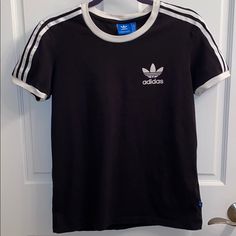 Adidas Women’s T-Shirt. Nwot Size: Xs Never Worn, Washed Once. Cheap Adidas T-shirt For Sports Events, Casual Fitted T-shirt With Three Stripes, Fitted Casual T-shirt With Three Stripes, Trendy Adidas T-shirt With Letter Print, Adidas Basic T-shirt With Three Stripes, Basic Adidas T-shirt With Three Stripes, Basic Three Stripes Crew Neck T-shirt, Black Crew Neck T-shirt With Three Stripes, Black Three Stripes Crew Neck T-shirt