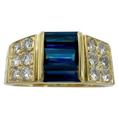 Rare Vintage Van Cleef & Arpels Baguette Cut Blue Sapphire And Diamond 18k Yellow Gold Cocktail Band Ring. A stunning vintage ring with a unique design typical of Van Cleef & Arpels, set with beautiful natural baguette cut deep blue sapphires and round brilliant cut diamonds. The sapphires have a fine deep royal blue colour with an excellent baguette cut and perfectly matched. These total 1.03ct as engraved on the ring. They give a total width at the top of the ring of 7.2mm The sapphires are accented by 2 rows of natural diamonds on the shoulders of the ring. Measuring 2mm and graduating down to 1.8mm. Approx. 0.33ct total. These natural round brilliant cut diamonds have excellent D-F colour and VS-VVS Clarity. Fine jewellery houses like Van Cleef & Arpels only use the finest natural diam Van Cleef Arpels Blue, Vintage Van Cleef, Cocktail Vintage, Van Cleef & Arpels, Deep Royal Blue, Gold Cocktail, Blue Sapphire Diamond, Vintage Vans, Royal Blue Color