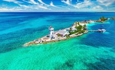 an island with a lighthouse in the middle