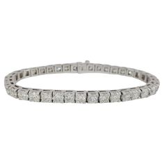 Indulge in the epitome of luxury with our extraordinary 8-carat Diamond Tennis Bracelet, a masterpiece crafted in lustrous 18k White Gold. This enchanting bracelet showcases a single row of impeccably matched diamonds, totaling an impressive 8 carats. Each diamond, with its exquisite (F-G Color, VS-SI Clarity) rating, radiates brilliance and fire. The timeless design of the tennis bracelet, coupled with the meticulous attention to detail in its creation, makes it a symbol of enduring elegance. T Gold Tennis Bracelet, Bracelet Tennis, Modern Bracelets, Diamond Tennis Bracelet, Tennis Bracelet Diamond, Fine Jewels, Tennis Bracelet, Round Brilliant Cut Diamond, Brilliant Cut Diamond