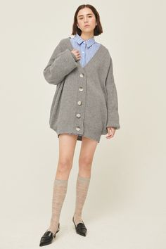 Lucy Boyfriend Cardigan Front button closure Super oversized cardigan Ribbed cuffs and hem * Product Specification 60% Wool 15% Nylon 13% Polyester 12% Acrylic * Flat Measurement: S/M: Shoulder: 80.5cm (31.7in) / Bust: 80.5cm (31.7in) / Sleeve: 50cm (19.7in) / Armhole: 23cm (9.1in) / Length: 79.5cm (31.3in) / M/L: * Professional Clean Only / Do Not Tumble Dry Model's height is 5′ 7″ (176cm) Bust 31in Waist 23in Hip 34in and wearing S/M 사이즈 정보Size information (단위:cm)(Unit : inch) S/MS/M 사이즈 정보 Si Trendy Oversized Button-up Cardigan, Oversized Soft Knit Button-up Cardigan, Oversized Gray Outerwear With Buttons, Oversized Casual Cardigan With Button Cuffs, Oversized Gray Winter Cardigan, Oversized Cardigan With Ribbed Cuffs, Oversized Button-up Cardigan With Button Closure, Oversized Casual Sweater With Button Cuffs, Trendy Oversized Gray Sweater Coat