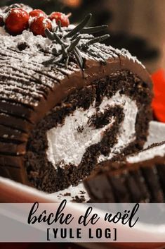 a close up of a piece of cake on a plate with the title yule log cake buche de noel