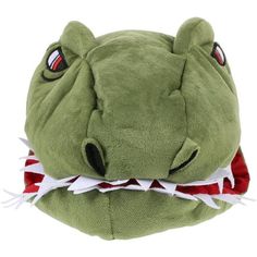 a green stuffed animal with red and white teeth