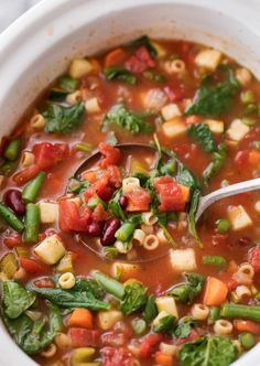 a white bowl filled with soup and vegetables