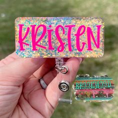 Rectangle 2.75 inches long by 1.25 inches tall, backed in a GORGEOUS Jewel iridescent glitter, ft your name in neon pink! Sealed for durability and longevity. Attached to a retractable alligator swivel clip badge reel. Nurse Crafts, Badge Ideas, Reels Ideas, Cute Badge Reel, Personalised Badges, Bead Loom Designs, Nurse Stuff, Badge Buddy, Work Badge