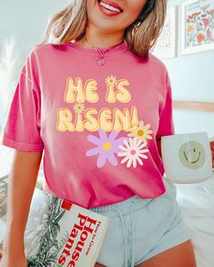 Super cute Easter shirt; He is Risen! Comfort Colors introduces its garment-dyed t-shirt; a fully customizable tee made 100% with ring-spun cotton. The soft-washed, garment-dyed fabric brings extra coziness to your wardrobe while the relaxed fit makes it an excellent daily choice. The double-needle stitching throughout the tee makes it highly durable while the lack of side-seams helps the shirt retain its tubular shape. .: 100% ring-spun cotton .: Medium fabric (6.1 oz/yd² (206.8 g/m .: Relaxed Christian Easter Shirts, Easter Shirts For Women, Babe T Shirt, Retro Easter, Easter Shirts, Tshirt Printing, Shirts Cute, Tshirt Printing Design, Chicken Shirts