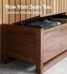 a wooden storage bench with an open drawer on the top and below it that reads, new from scan yo