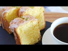 a plate topped with slices of cake next to a cup of coffee