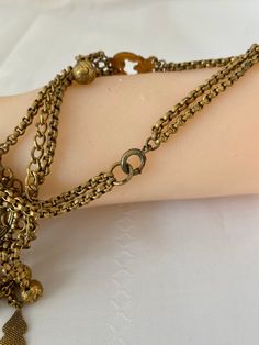 "Etruscan Revival Festoon Necklace and Bracelet Set Gold Tone Ornate Vintage Patina Necklace - 16.5\" plus festoon drop with dangles additional 4\" Length Bracelet - 7.5\" Bracelet medallion 1.76x x 1.50@ No markings Aged patina, can use white vinegar to brighten if preferred" Bohemian Metal Bracelets With Latkans, Vintage Festival Jewelry With Adjustable Chain, Metal Bracelets With Latkans For Festival, Adjustable Brass Jewelry With Latkans, Decorative Vintage Jewelry For Festivals, Bohemian Chain Bracelets For Festivals, Antique Gold Vintage Jewelry For Festivals, Antique Gold Jewelry For Festivals, Vintage Antique Gold Jewelry For Festivals