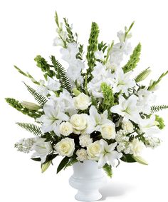 white flowers and greenery in a vase