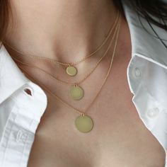 The Chiara necklace is a light gold round disc necklace that you just NEED. Wheather you wear it alone or stacked, with your another necklace or bare alone- it's perfect. Add a personal touch to your Chiara necklace with an engraved portrait of a loved one on one side and their name engraved on the opposite side. If you can dream it- we can make it happen. All features can be customized! Talk to us, we love making custom designs. Our jewelry is carefully handmade in our atelier To order by phone call +972(0)722991000 Circle Shaped Yellow Gold Necklace With Adjustable Chain, Everyday Yellow Gold Circular Necklace, Everyday Circular Yellow Gold Necklace, 14k Gold Delicate Circle Chain Necklace, 14k Gold Delicate Circle Necklace, Everyday Round Disc Gold Plated Necklace, Gold Full Circle Necklace With Adjustable Chain, Everyday Gold Plated Round Disc Necklace, Gold Full Circle Necklaces With Adjustable Chain